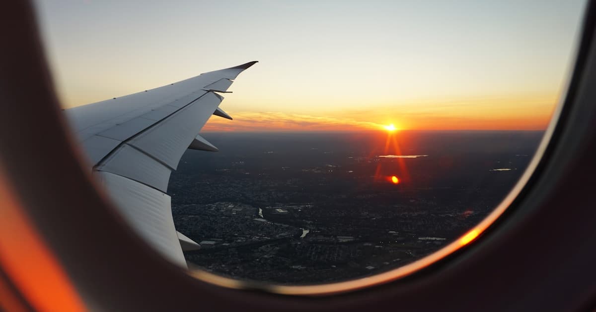 Aeroplane flying over clouds representing frequent flyer points