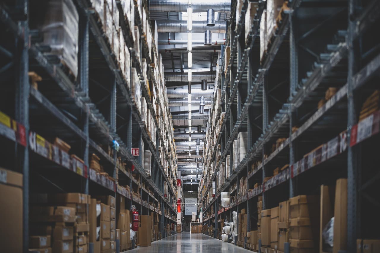 Warehouse shelves stocked with products representing business liability and inventory risk